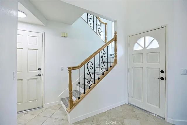 wooden floor with windows and entryway
