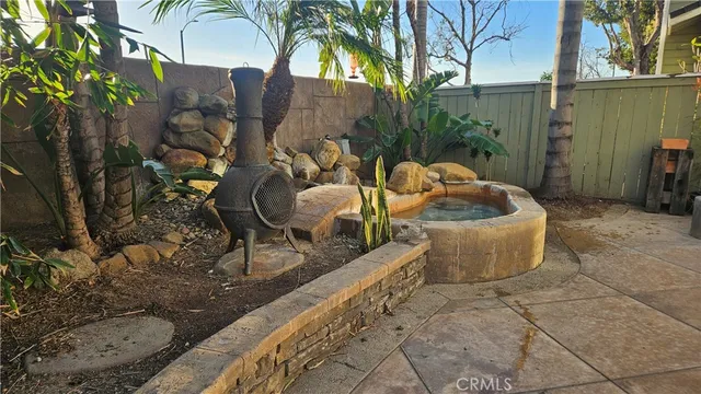 a view of a couches and dinning table in patio