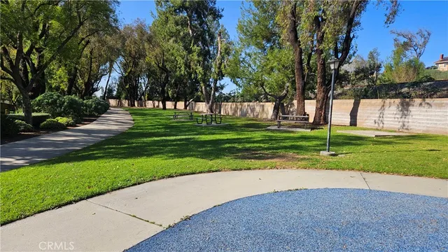 a view of a swimming pool with an outdoor seating
