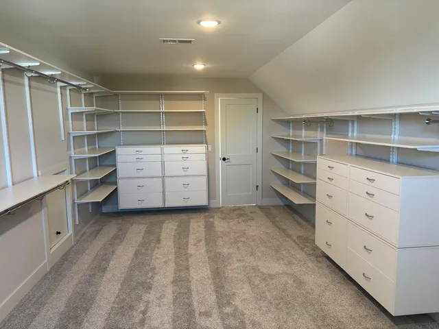 a view of an empty walk in closet