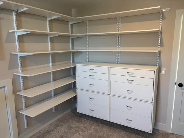 a view of a closet with cabinet