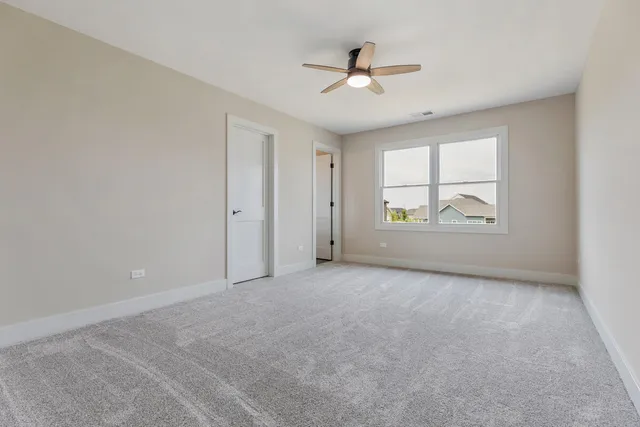a bathroom with a double vanity sink toilet and shower