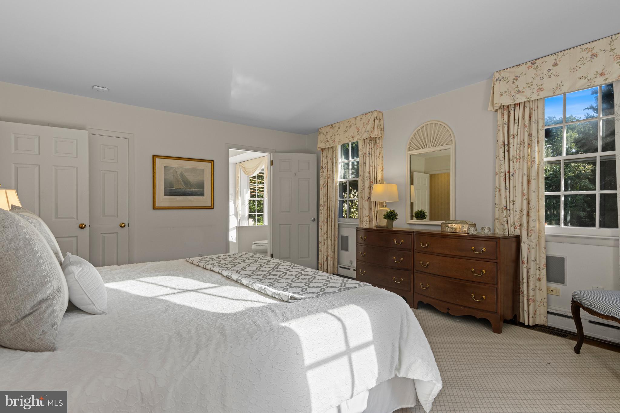 590 Cricket Lane Wayne, PA 19087 - Photo 34 of 65 a bedroom with a bed and a large mirror on dresser