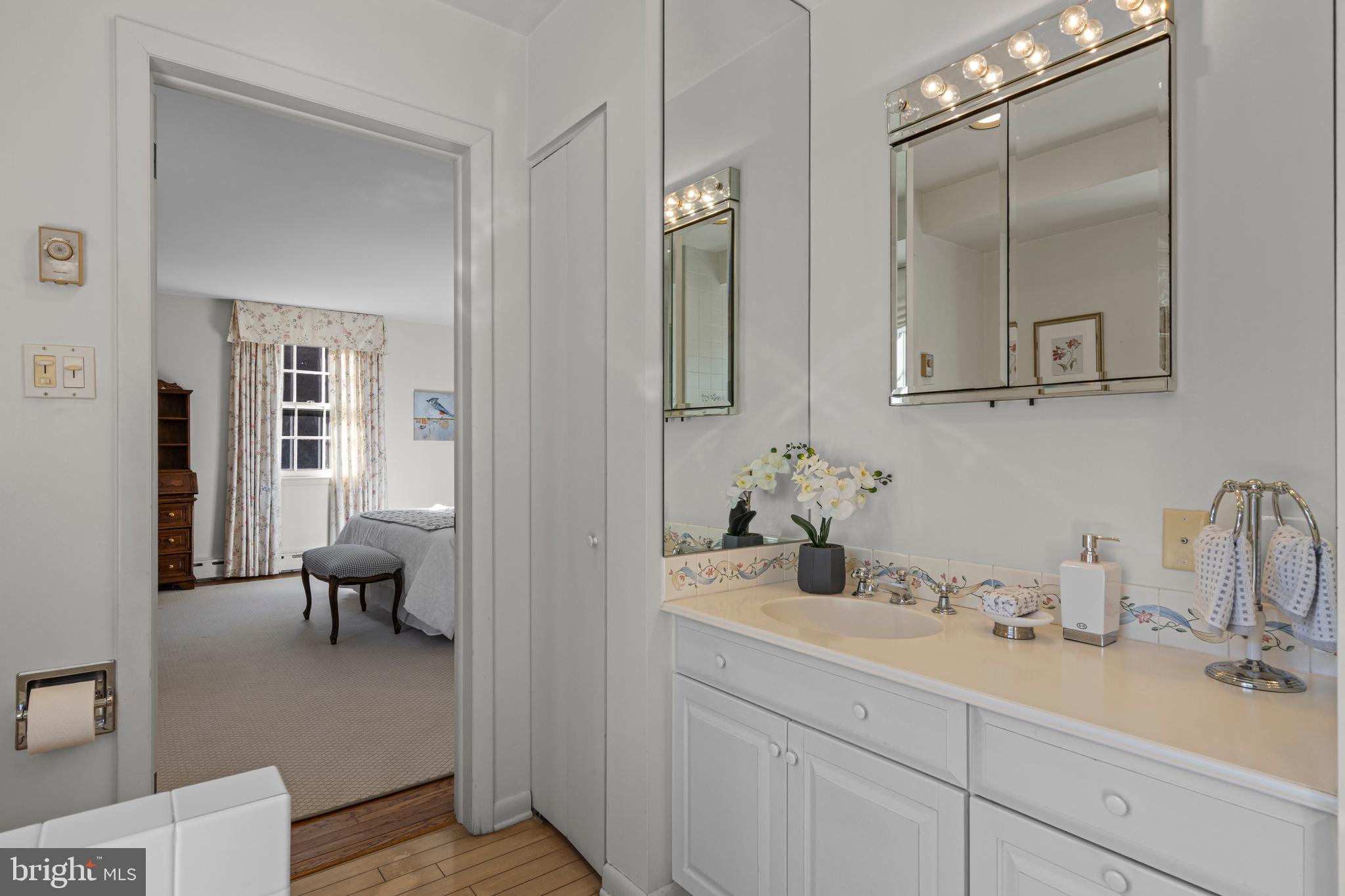 590 Cricket Lane Wayne, PA 19087 - Photo 38 of 65 a en suite bathroom with double sink and a mirror