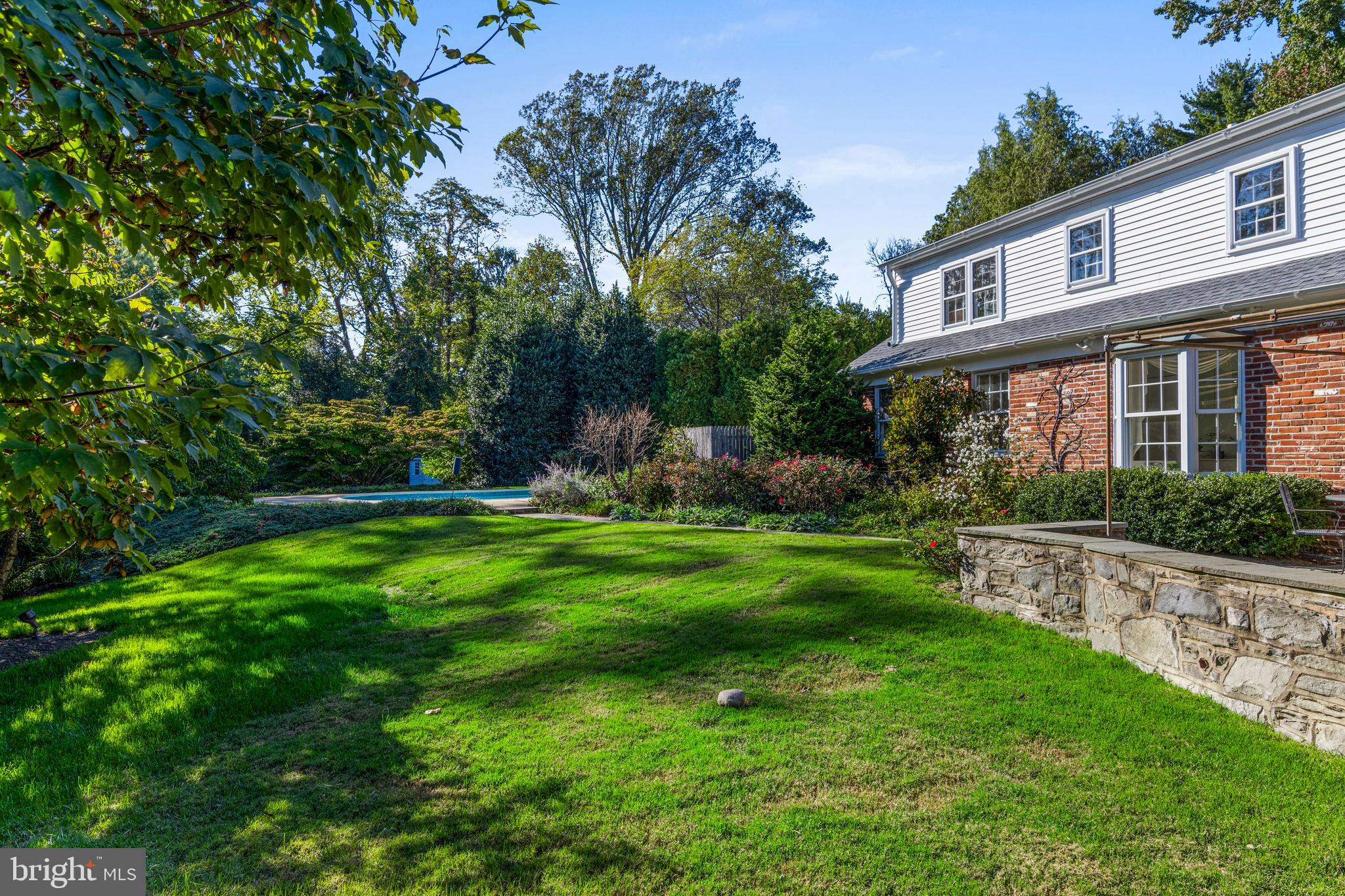590 Cricket Lane Wayne, PA 19087 - Photo 53 of 65 a view of a house with a yard and a garden