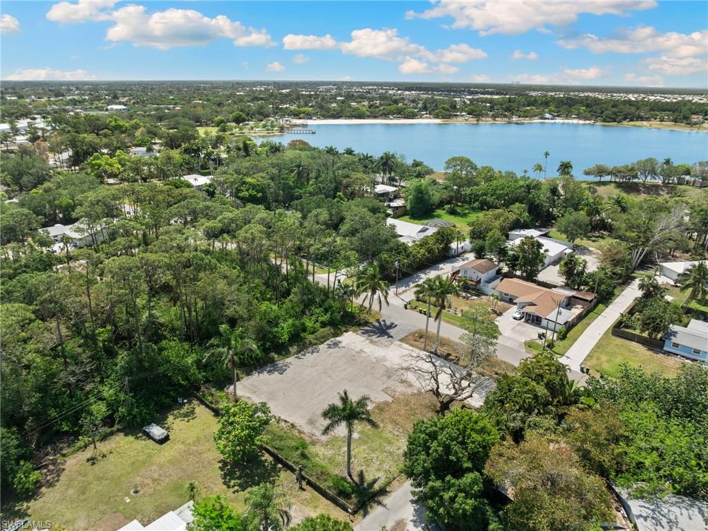 3417 Guilford Road Naples, FL 34112 - Photo 2 of 10 an aerial view of residential houses with outdoor space and trees