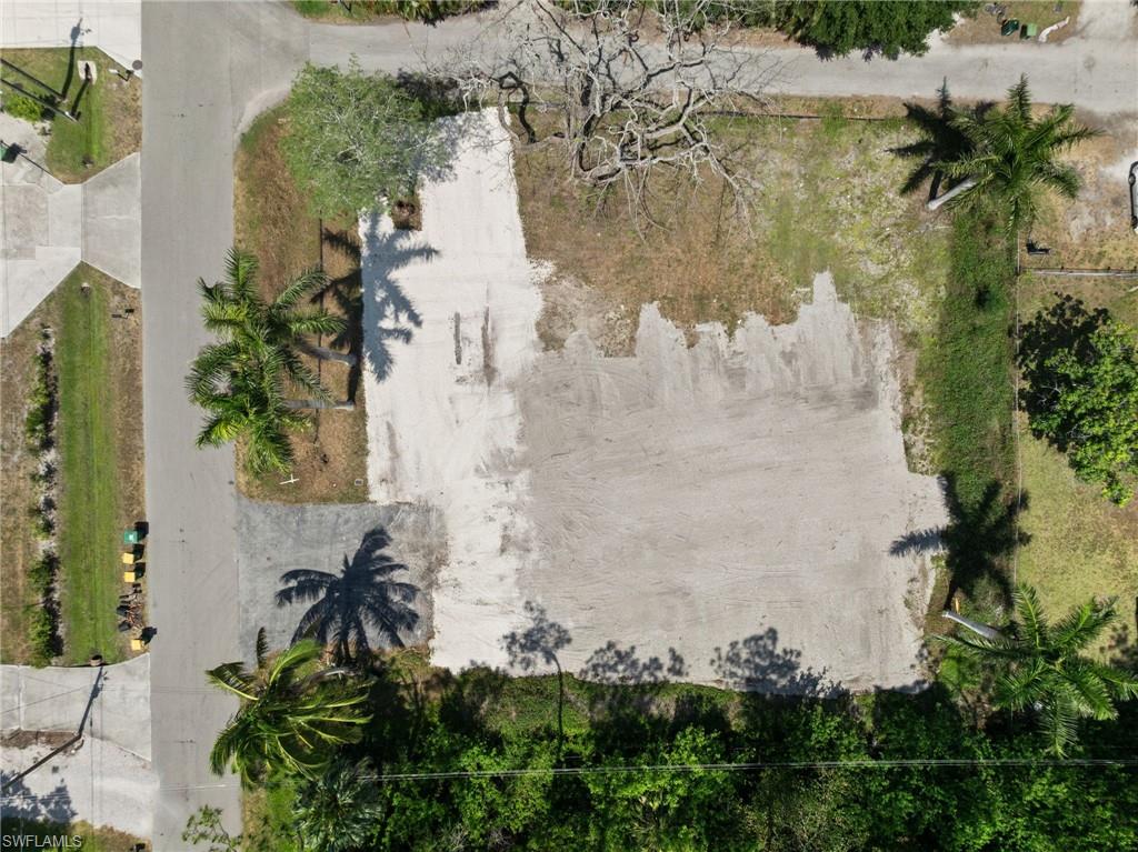 3417 Guilford Road Naples, FL 34112 - Photo 10 of 10 an aerial view of a house with a yard and large trees