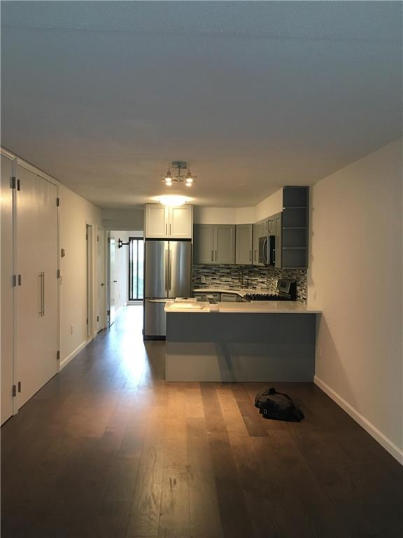 a view of kitchen with wooden floor