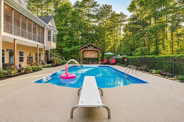 8179 Pineview Court Villa Rica, GA 30180 - Photo 37 of 41 a view of swimming pool with a yard and plants