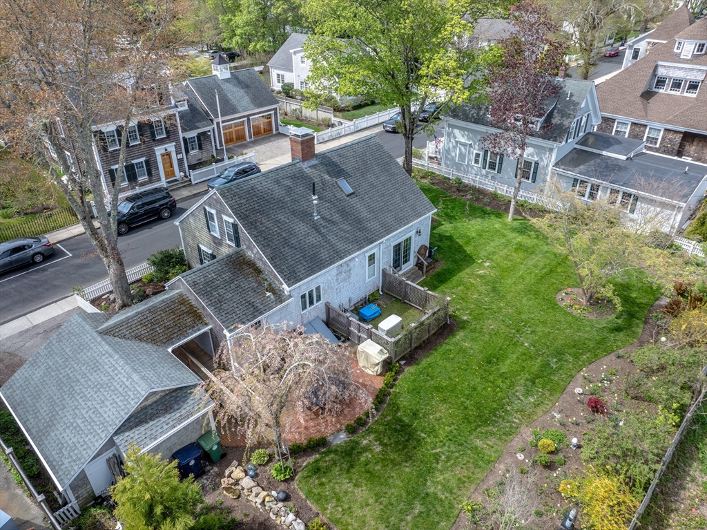 31 Main Street Marion, MA 02738 - Photo 3 of 29 an aerial view of multiple houses with yard