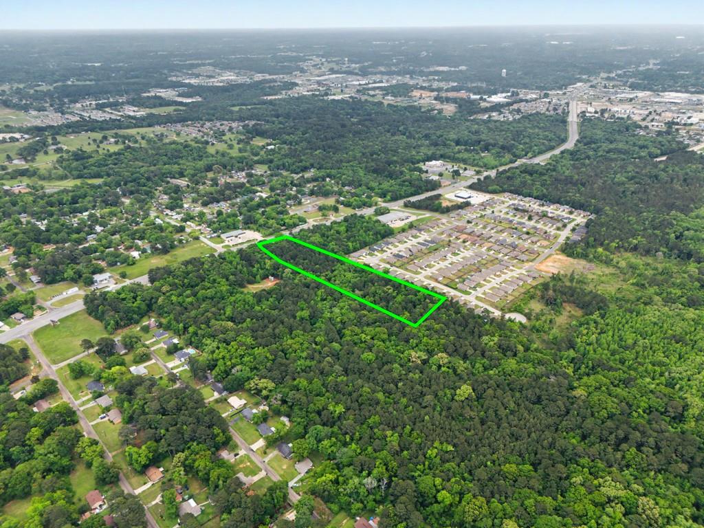 4107 Judson Road Longview, TX 75605 - Photo 3 of 8 Expansive wooded parcel outlined in green, featuring significant tree coverage