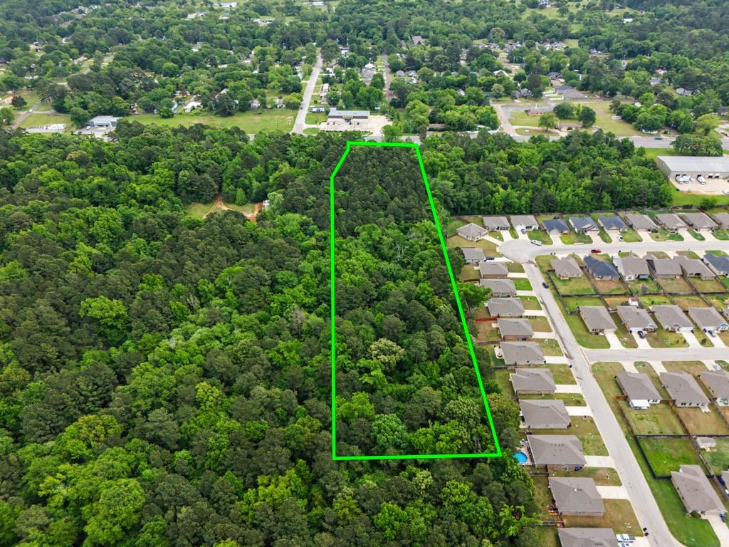 4107 Judson Road Longview, TX 75605 - Photo 8 of 8 Expansive wooded acreage outlined in green, featuring dense tree cover