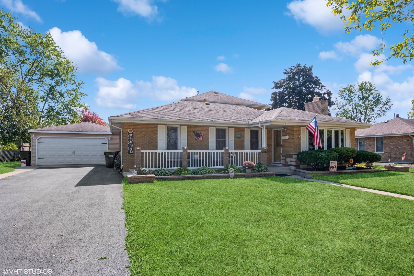 5837 109th Place Chicago Ridge, IL 60415 - Photo 1 of 20 a front view of a house with a yard and porch