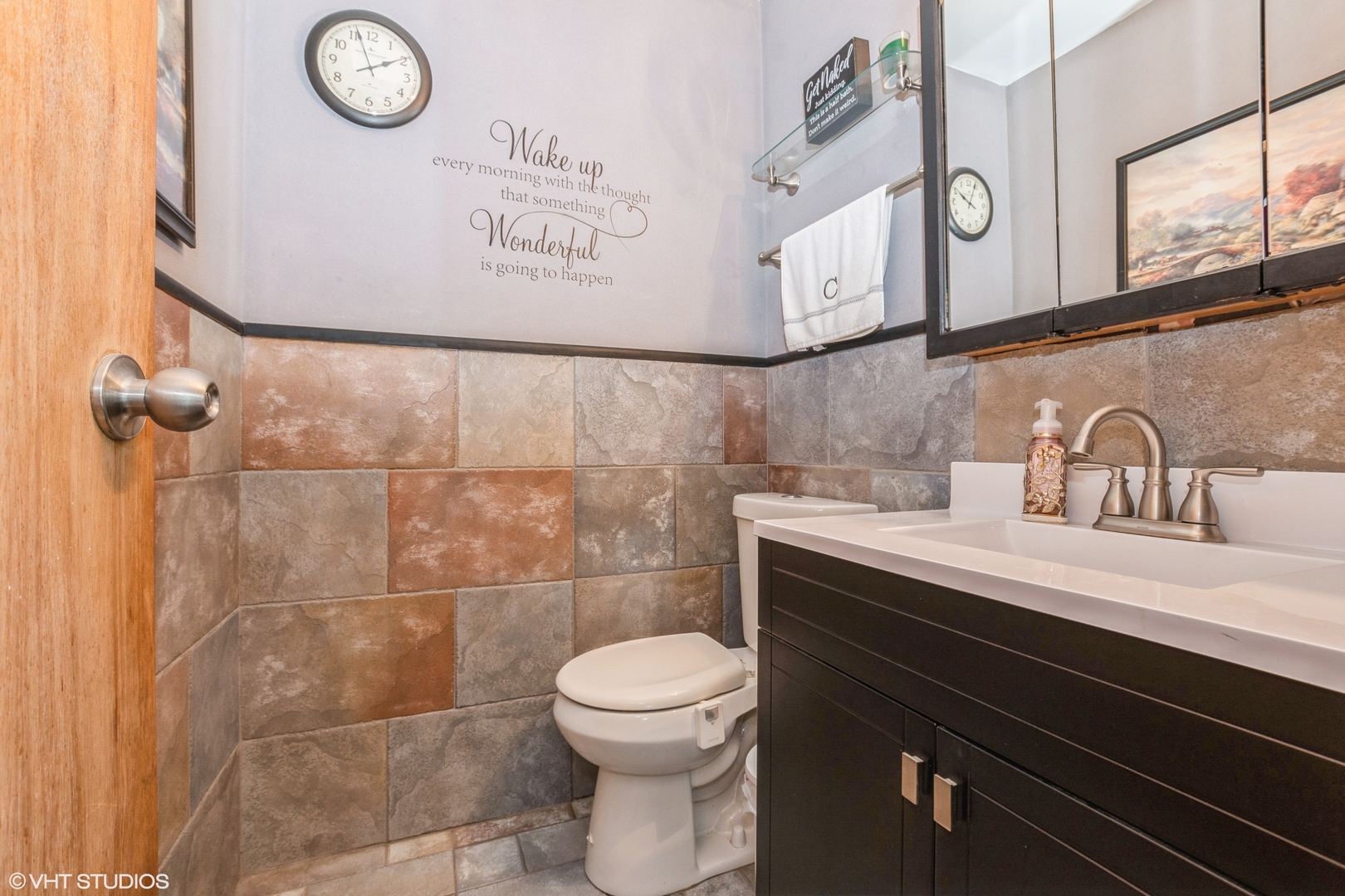5837 109th Place Chicago Ridge, IL 60415 - Photo 13 of 20 a bathroom with a sink a toilet and a mirror