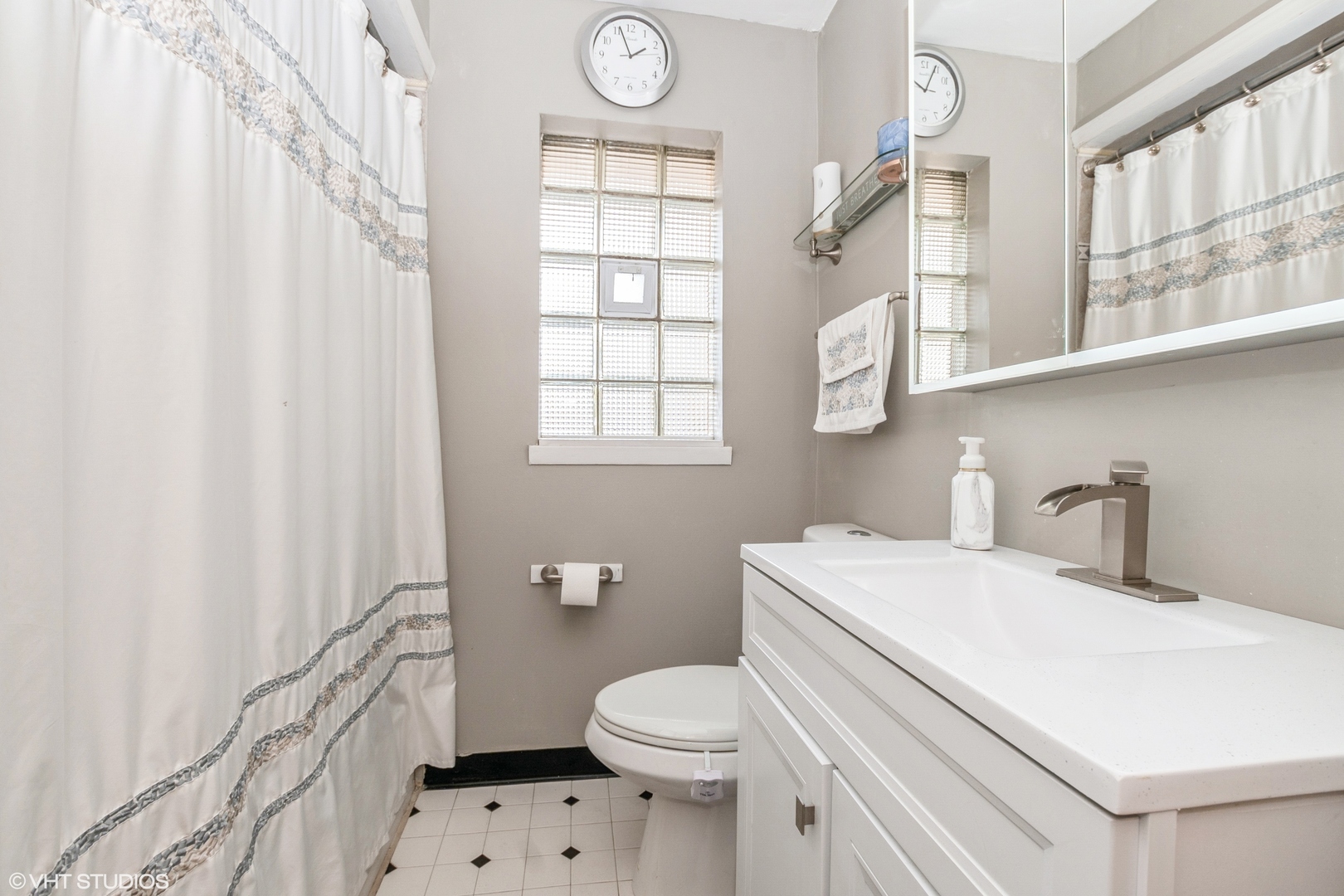 5837 109th Place Chicago Ridge, IL 60415 - Photo 14 of 20 a bathroom with a sink a toilet and a window
