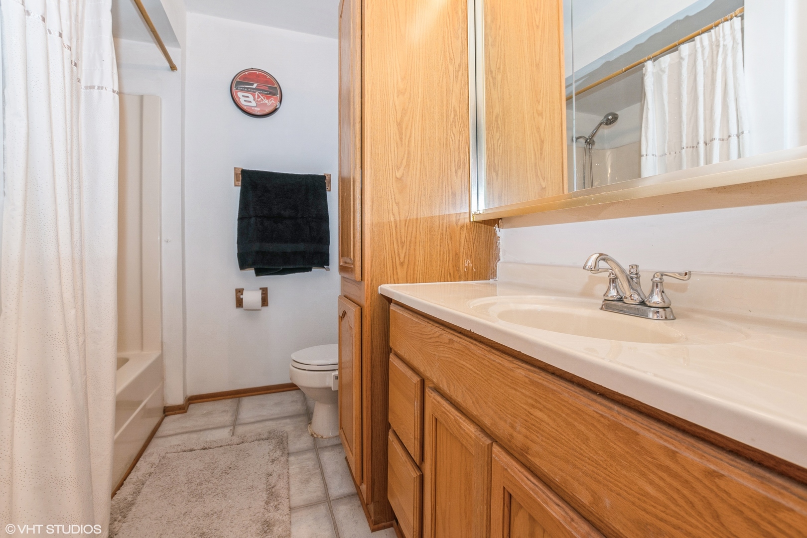 5837 109th Place Chicago Ridge, IL 60415 - Photo 17 of 20 a bathroom with a granite countertop toilet sink and mirror