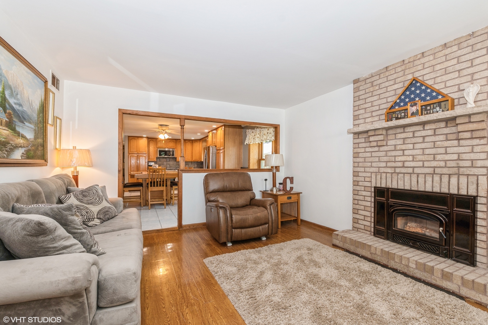 5837 109th Place Chicago Ridge, IL 60415 - Photo 4 of 20 a living room with furniture and a fireplace
