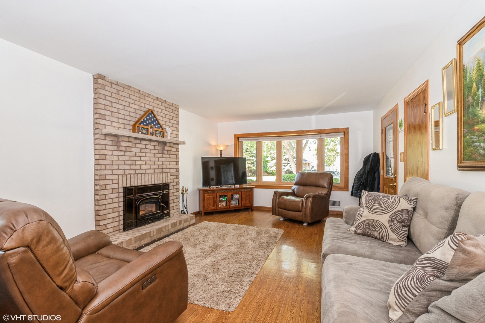 5837 109th Place Chicago Ridge, IL 60415 - Photo 5 of 20 a living room with furniture or couch and a fireplace