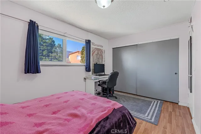 a bedroom with a bed and a table in it