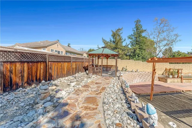 a view of a backyard with a patio
