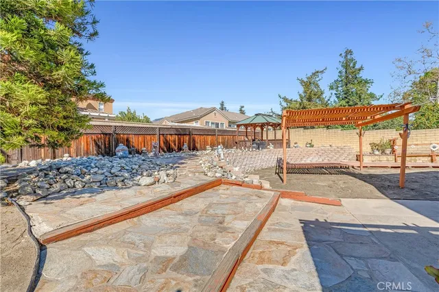 a view of swimming pool with a lounge chair