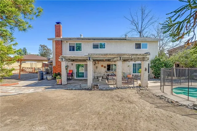 an aerial view of residential house and sandy dunes