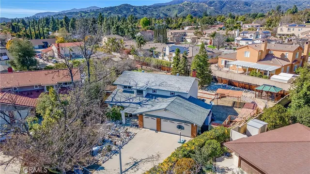 an aerial view of residential house and sandy dunes
