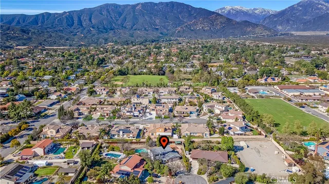 an aerial view of residential houses with outdoor space