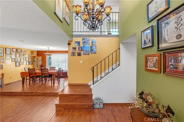 a view of a livingroom with furniture and hardwood floor
