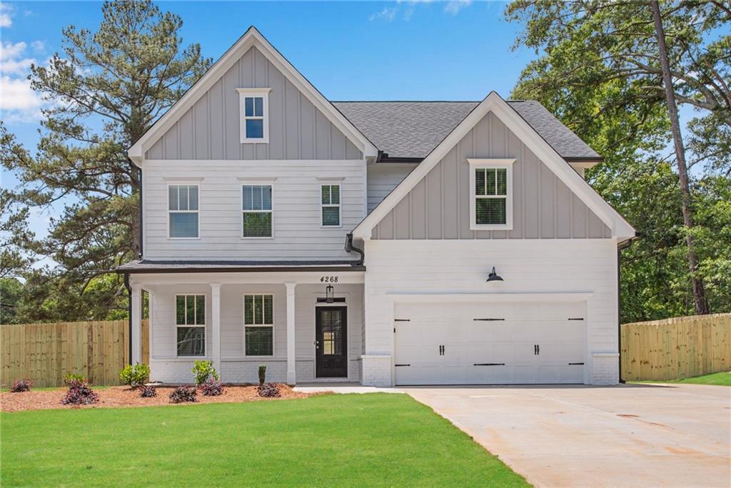 4268 Floyd Road Austell, GA 30106 - Photo 1 of 1 a front view of a house with a yard