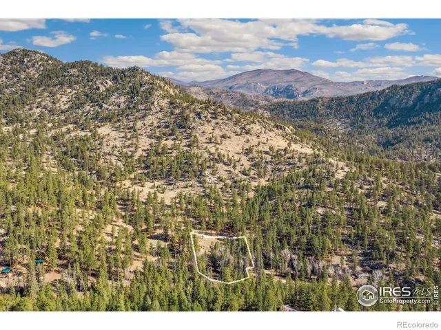 a view of a city with mountains in the background