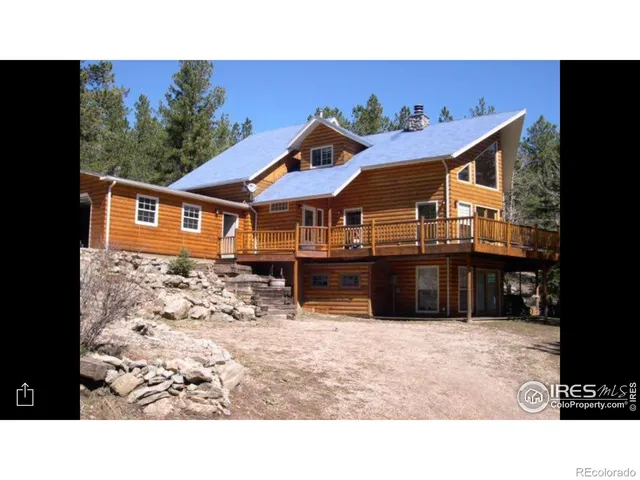 a balcony with a sink and potted plants