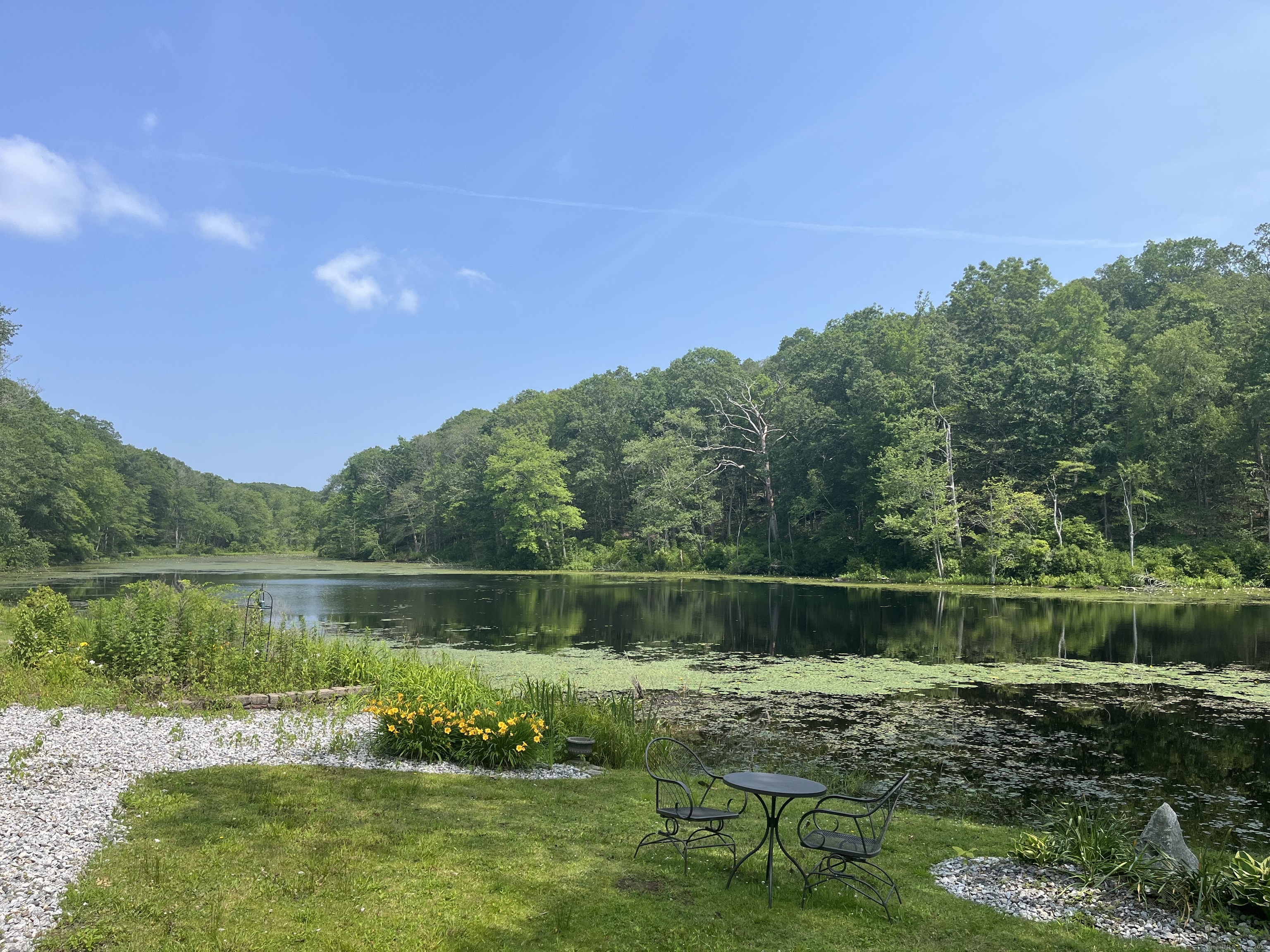 538 Winthrop Road Deep River, CT 06417 - Photo 4 of 11 a view of a lake with a yard