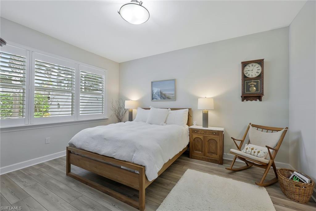 10787 Manatee Key Lane Estero, FL 33928 - Photo 11 of 31 a bed room with a bed and a chair