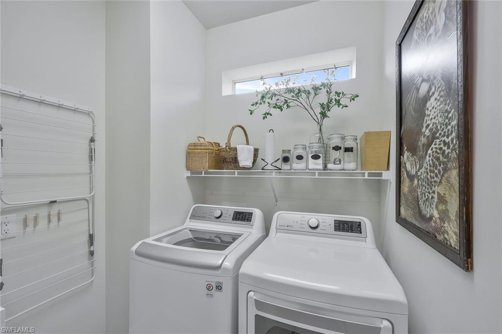 10787 Manatee Key Lane Estero, FL 33928 - Photo 16 of 31 a utility room with dryer and washer