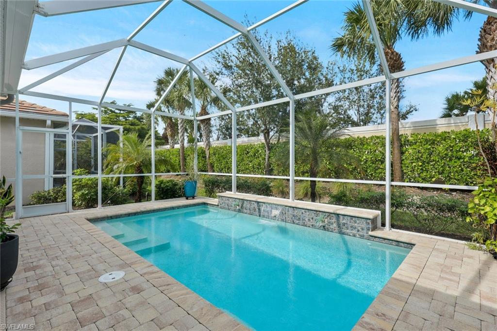 10787 Manatee Key Lane Estero, FL 33928 - Photo 20 of 31 a view of a backyard with a swimming pool