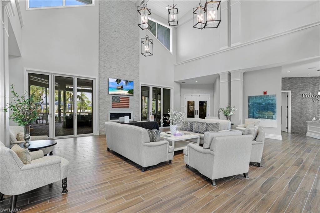 10787 Manatee Key Lane Estero, FL 33928 - Photo 28 of 31 a living room with furniture and a fireplace