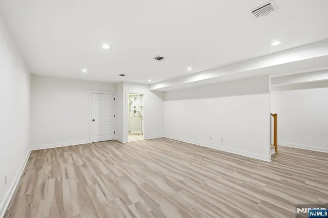 a view of room with wooden floor