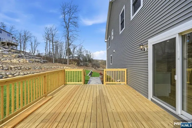 a view of balcony with wooden floor and outdoor space
