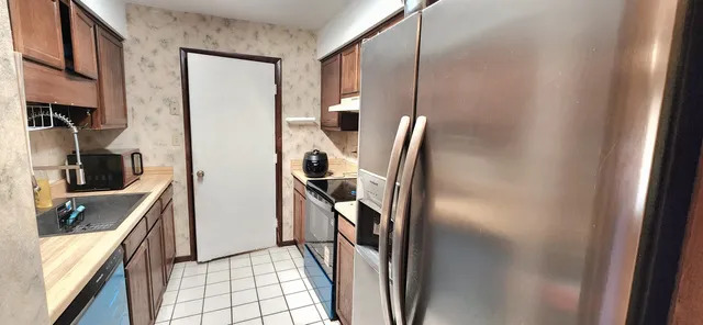a view of a kitchen from the hallway