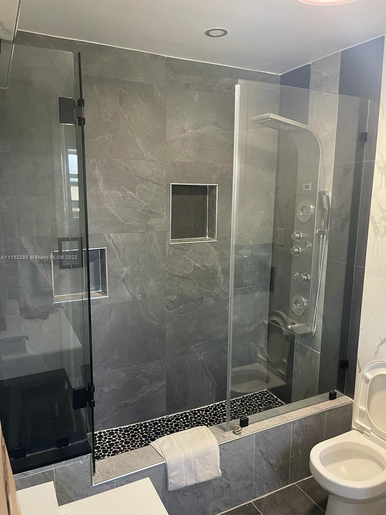 1115 North Park Road Hollywood, FL 33021 - Photo 5 of 6 a bathroom with a shower and a toilet