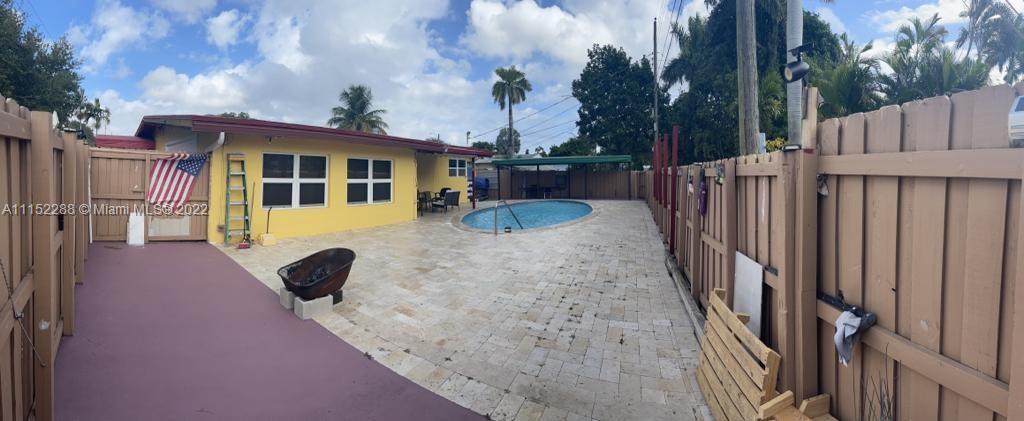 1115 North Park Road Hollywood, FL 33021 - Photo 6 of 6 a view of residential house with wooden fence