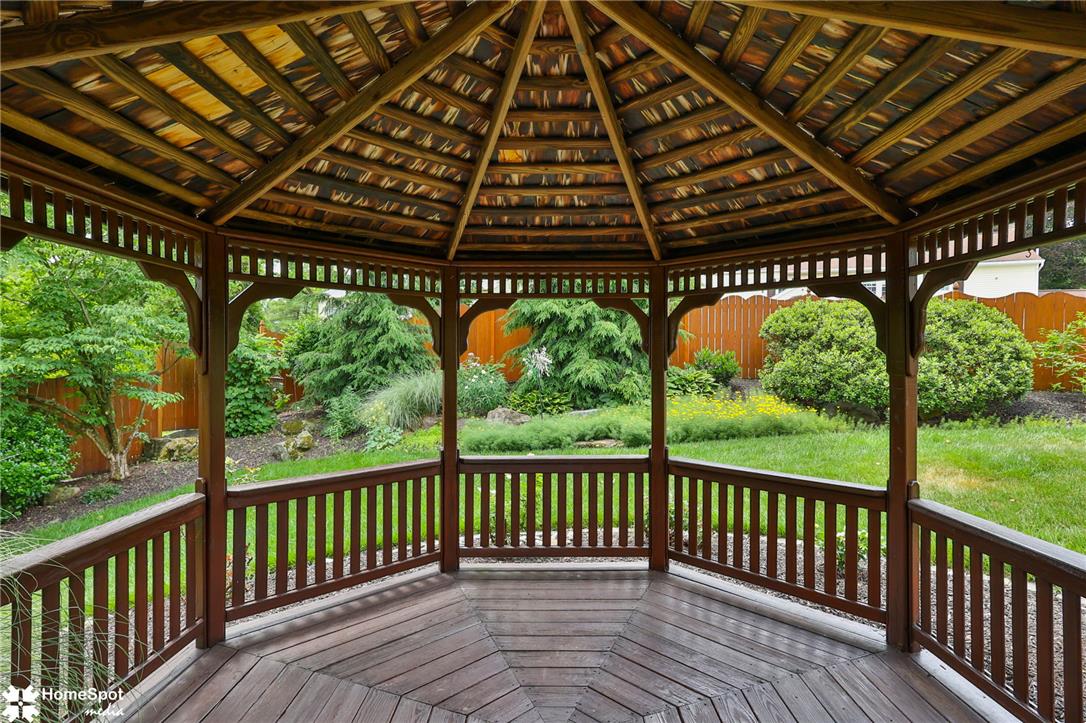 2821 Center Street Bethlehem, PA 18017 - Photo 68 of 68 Relax in this inviting gazebo, offering serene views of the lush, fenced yard and vibrant garden.