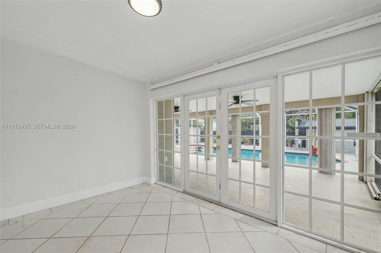 5936 Southwest 29th Street Miami, FL 33155 - Photo 12 of 32 a view of an empty room with window