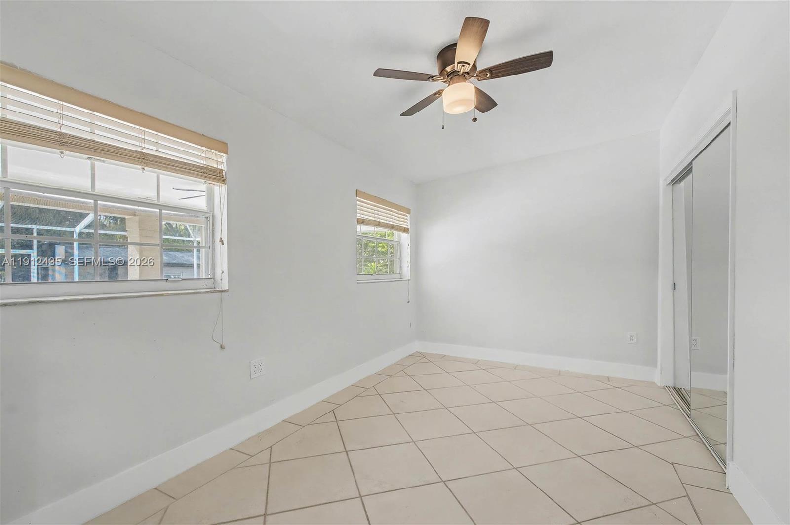 5936 Southwest 29th Street Miami, FL 33155 - Photo 20 of 32 a view of an empty room with a window