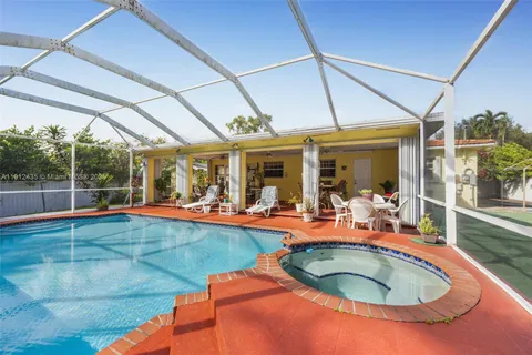 a view of a swimming pool with a patio