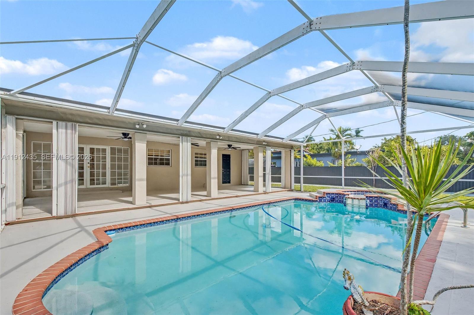 5936 Southwest 29th Street Miami, FL 33155 - Photo 23 of 32 a view of a house with a backyard