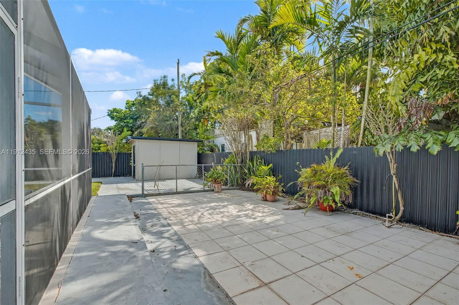 5936 Southwest 29th Street Miami, FL 33155 - Photo 24 of 32 a view of a house with a garden