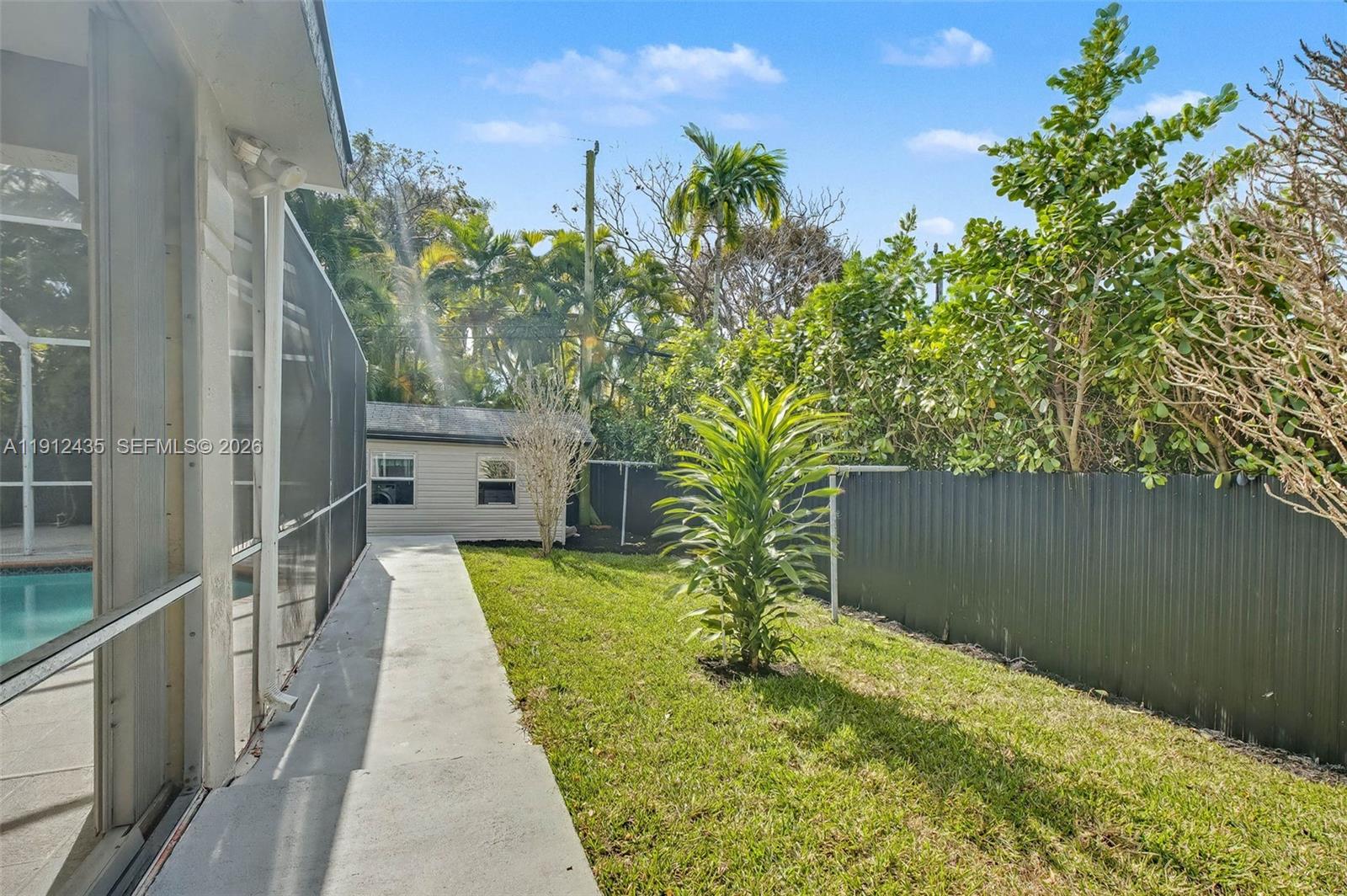5936 Southwest 29th Street Miami, FL 33155 - Photo 25 of 32 a view of a house with backyard