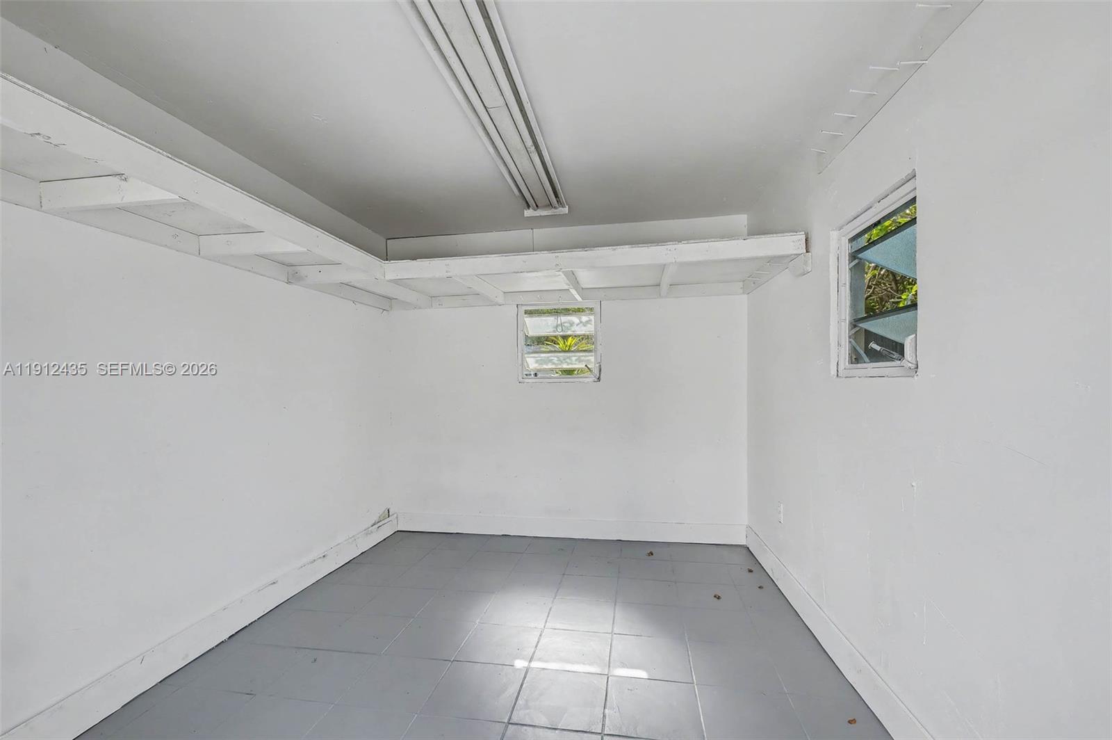 5936 Southwest 29th Street Miami, FL 33155 - Photo 27 of 32 a view of storage and utility room with washer and dryer